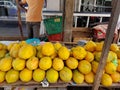 Ripe fruits of yellow papaya stacked at a local market of fruit and vegetable