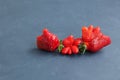 Ripe funny strawberry berries. Trendy food. Concept - Food waste reduction. Using in cooking imperfect products