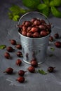 Ripe gooseberries fruit in bucket on grey wooden table Royalty Free Stock Photo