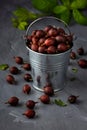 Ripe gooseberries fruit in bucket on grey wooden table