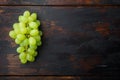 Ripe grape, green fruits, on old dark  wooden table , top view flat lay, with copy space for text Royalty Free Stock Photo