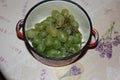Ripe grape in small deep enamel pan Royalty Free Stock Photo