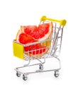 Ripe grapefruits in shopping cart