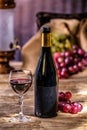 Ripe grapes red wine glass and bottle of wine Royalty Free Stock Photo