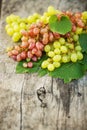 Ripe grapes on a wooden table outdoors. Fresh rich grapes on the