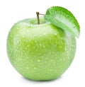 Ripe green apple with water drops on it.