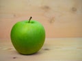 Ripe green apples on the wood floor Royalty Free Stock Photo