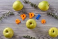 Ripe green apples on wooden grey table. Royalty Free Stock Photo