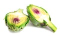 Two halves of ripe green artichokes on a white background Royalty Free Stock Photo