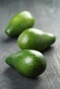 Ripe green avocados on wood table