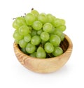 Ripe green grapes in wood bowl