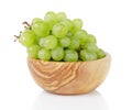 Ripe green grapes in wood bowl