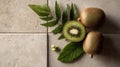 Ripe Green Kiwis with Leaves on Brown Tile Background Royalty Free Stock Photo