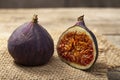 Ripe half figs of an old wooden table and burlap