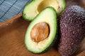 Ripe halved avocado on plate. Closeup.