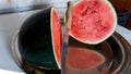 Ripe halved watermelon cut on a tray