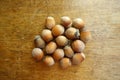 Ripe hazelnuts on wooden table Royalty Free Stock Photo