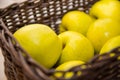 Ripe and juicy apples of Golden Delishes sort lie in a wicker basket Royalty Free Stock Photo
