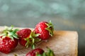 Ripe juicy beautiful red strawberry on a wooden background closeup Royalty Free Stock Photo