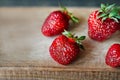 Ripe juicy beautiful red strawberry on a wooden background closeup Royalty Free Stock Photo