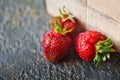 Ripe juicy beautiful red strawberry on a wooden background closeup Royalty Free Stock Photo