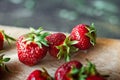 Ripe juicy beautiful red strawberry on a wooden background closeup Royalty Free Stock Photo