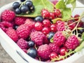 Ripe and juicy berries on an old wooden background.