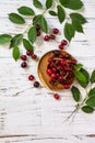 Ripe juicy berry cherry in a bowl on a kitchen rustic table. Royalty Free Stock Photo