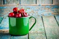 Ripe juicy cherries in the old mug Royalty Free Stock Photo