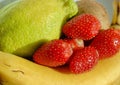 Ripe, juicy, fragrant strawberries and bananas, lemon and kiwi