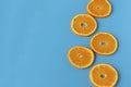 Ripe juicy orange on a blue background. Citrus fruit. Vitamins and Food for Vegetarians.