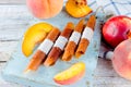 Ripe juicy peach and peach candy pastille Royalty Free Stock Photo