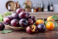 Ripe juicy plums on a kitchen table Royalty Free Stock Photo