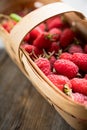 Ripe juicy raspberries in vintage basket