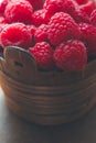 Ripe juicy raspberries in a vintage wooden basket Royalty Free Stock Photo