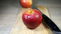 Ripe juicy red apple on a wooden cutting board Royalty Free Stock Photo