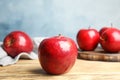 Ripe juicy red apples on wooden table Royalty Free Stock Photo