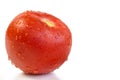 Ripe juicy red tomato covered with water drops. Close-up. macro photography. White background Royalty Free Stock Photo