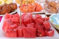 Ripe juicy red watermelon cubes on a white plate. Watermelon cubes ready for eat