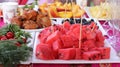 Ripe juicy red watermelon cubes on a white plate. Watermelon cubes ready for eat