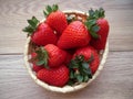 Ripe juicy strawberries in a wicker basket. Royalty Free Stock Photo