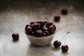 Ripe juicy sweet cherries with water drops in a ceramic bowl Royalty Free Stock Photo