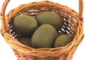 Ripe kiwi fruits in brown wicker basket isolated Royalty Free Stock Photo