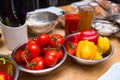 Ripe large red tomatoes on a branch and bell peppers Royalty Free Stock Photo