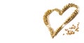 Ripe Love - Heart shape made of golden wheat stems isolated on white background as a design element for love and harwest themes.