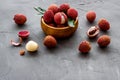 Ripe lychee. Exotic asian fruits in bowl on grey desk copy space Royalty Free Stock Photo