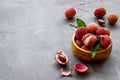 Ripe lychee. Exotic asian fruits in bowl on grey desk copy space Royalty Free Stock Photo