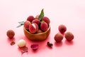 Ripe lychee. Exotic asian fruits in bowl on pink desk Royalty Free Stock Photo