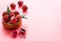 Ripe lychee. Exotic asian fruits in bowl on pink desk copy space Royalty Free Stock Photo