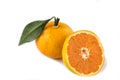 Ripe mandarins with leaves close-up on a white background